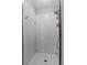 Tiled shower with shower head and glass door at 425 Eagle Ridge Dr # 425, Davenport, FL 33837