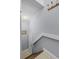 A charming staircase with wooden steps and a white railing leads to the upper level at 425 Eagle Ridge Dr # 425, Davenport, FL 33837
