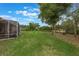 Large backyard with lush lawn and mature trees, perfect for outdoor activities and relaxation at 441 Hightower Dr, Debary, FL 32713