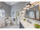 Tastefully updated bathroom with elegant fixtures, vanity with stone countertop, and a door to the outside at 441 Hightower Dr, Debary, FL 32713