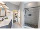 Updated bathroom with a walk-in shower with modern tile, vanity, and an open doorway into another room at 441 Hightower Dr, Debary, FL 32713