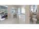 Open ensuite bathroom features a glass shower and soaking tub; bedroom visible in background; toilet in separate room at 441 Hightower Dr, Debary, FL 32713