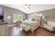 The main bedroom features vaulted ceiling, hardwood floors, and natural lighting at 441 Hightower Dr, Debary, FL 32713