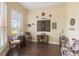 Fun bonus room featuring hard wood floors, dart board, rustic western decor and a cow print chair at 441 Hightower Dr, Debary, FL 32713
