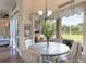 Breakfast nook with view of screened porch and seating for four people at 441 Hightower Dr, Debary, FL 32713