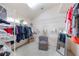 Walk-in closet with adjustable wire shelving, ample storage space, a comfortable chair, and a full length mirror at 441 Hightower Dr, Debary, FL 32713