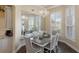 Dining room boasts hardwood floors, chandelier, and large mirror at 441 Hightower Dr, Debary, FL 32713