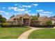 Inviting brick home with a well-maintained lawn and a curved walkway leading to the front entrance at 441 Hightower Dr, Debary, FL 32713