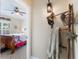Hallway view of a bedroom with vintage decor, a ladder with blankets, and a view into the room at 441 Hightower Dr, Debary, FL 32713