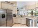 Kitchen features stainless steel appliances, granite countertops and open breakfast nook at 441 Hightower Dr, Debary, FL 32713