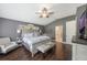 The main bedroom features vaulted ceiling, hardwood floors, and private en-suite bathroom at 441 Hightower Dr, Debary, FL 32713