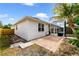 The backyard features a screen patio, small patio, and a partial privacy fence at 4558 Redmond Pl, Sanford, FL 32771