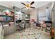 Bright bedroom with built-in storage, gray shelving and cabinets, and a ceiling fan at 4558 Redmond Pl, Sanford, FL 32771
