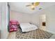 Bright bedroom with a ceiling fan, a patterned rug, and neutral tones create a calming atmosphere at 4558 Redmond Pl, Sanford, FL 32771