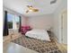 Serene bedroom with a ceiling fan, soft carpet, and natural light creates a peaceful retreat at 4558 Redmond Pl, Sanford, FL 32771