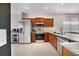 Bright kitchen featuring stainless steel appliances, granite countertops, and tiled flooring at 4558 Redmond Pl, Sanford, FL 32771