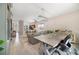 Open-concept living space features dining area, seamless flow to kitchen, and bright, airy atmosphere at 4558 Redmond Pl, Sanford, FL 32771