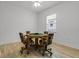 Cozy game room with an octagonal table, rolling chairs, and light wood flooring at 5013 E Fountainwood Dr, St Cloud, FL 34772
