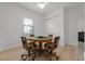 Cozy game room with an octagonal table, rolling chairs, and light wood flooring at 5013 E Fountainwood Dr, St Cloud, FL 34772