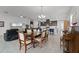 Open living space featuring tile flooring, dining and kitchen, and comfortable seating at 5013 E Fountainwood Dr, St Cloud, FL 34772