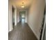 Welcoming entryway boasts wood-look tile flooring and neutral paint at 5262 Teirgarten St, St Cloud, FL 34771