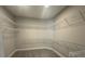 Spacious walk-in closet offers ample storage with built-in shelving and organizational system at 5262 Teirgarten St, St Cloud, FL 34771