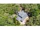 Aerial view of a house surrounded by trees in a natural setting at 5655 Oak Hollow Ln, Oviedo, FL 32765