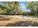 Outdoor basketball court surrounded by mature trees providing shade at 5655 Oak Hollow Ln, Oviedo, FL 32765