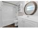 Bathroom with a bathtub and shower, vanity, large mirror and shelves at 5655 Oak Hollow Ln, Oviedo, FL 32765