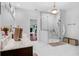 Bright bathroom boasts an expansive shower and a dark wood vanity with double sinks at 5655 Oak Hollow Ln, Oviedo, FL 32765