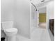 Well-lit bathroom featuring a marble shower with a built-in niche and modern fixtures at 5655 Oak Hollow Ln, Oviedo, FL 32765