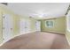 Bright bedroom with a ceiling fan, double closet, and a natural light from the window at 5655 Oak Hollow Ln, Oviedo, FL 32765