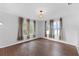 Comfortable bedroom with hardwood floors, natural light, and neutral decor at 5655 Oak Hollow Ln, Oviedo, FL 32765