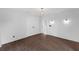 Bedroom with hardwood flooring, shiplap accent wall, and modern lighting fixtures at 5655 Oak Hollow Ln, Oviedo, FL 32765