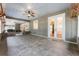 A view of the covered patio featuring brick trim, ceiling fans, and an entrance to the home at 5655 Oak Hollow Ln, Oviedo, FL 32765