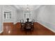 Elegant dining room with tray ceiling, chandelier, and classic furnishings at 5655 Oak Hollow Ln, Oviedo, FL 32765