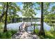 Inviting water views with a dock and lush foliage at 5655 Oak Hollow Ln, Oviedo, FL 32765