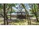 Stunning home exterior with mature trees and inviting facade at 5655 Oak Hollow Ln, Oviedo, FL 32765