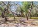 A home with mature trees providing shade at 5655 Oak Hollow Ln, Oviedo, FL 32765