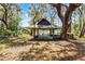Beautiful view of the gazebo sitting amongst mature trees and foliage at 5655 Oak Hollow Ln, Oviedo, FL 32765