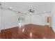 Bright living room offers hardwood floors and an open layout perfect for entertaining at 5655 Oak Hollow Ln, Oviedo, FL 32765