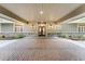Covered entrance featuring brick paving, double doors, and decorative lighting at 5655 Oak Hollow Ln, Oviedo, FL 32765