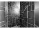 Unique stone tiled shower with natural stone of varying sizes in this home at 5655 Oak Hollow Ln, Oviedo, FL 32765