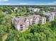 An aerial view of the apartments and the landscaped grounds surrounding the complex at 581 Brantley Terrace Way # 302, Altamonte Springs, FL 32714