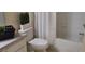 Bathroom with a white vanity, toilet, and a shower with a white curtain at 581 Brantley Terrace Way # 302, Altamonte Springs, FL 32714