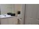 Well-lit bathroom with a spacious vanity, a large mirror, and a toilet at 581 Brantley Terrace Way # 302, Altamonte Springs, FL 32714