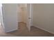 Neutral bedroom featuring a walk-in closet with ample shelving for storage at 581 Brantley Terrace Way # 302, Altamonte Springs, FL 32714