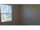 Bedroom with a bright window that provides natural light into the room at 581 Brantley Terrace Way # 302, Altamonte Springs, FL 32714