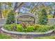 Brantley Terrace community sign surrounded by manicured landscaping provides a welcoming entrance at 581 Brantley Terrace Way # 302, Altamonte Springs, FL 32714