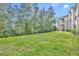 Expansive green lawn and landscaped grounds providing a tranquil setting next to the building at 581 Brantley Terrace Way # 302, Altamonte Springs, FL 32714